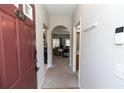 Inviting foyer with neutral tones and arched doorway leading to living areas at 2021 Austin Park Cir, Decatur, GA 30032