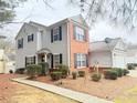 Two-story home with brick facade, vinyl siding, black shutters, and a garage at 235 Windcroft Nw Ln, Acworth, GA 30101