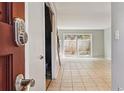 A welcoming entryway featuring tile flooring and a view of the backyard through sliding glass doors at 2551 Bradford Ne Sq, Atlanta, GA 30345