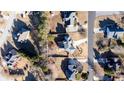 Aerial view of a suburban home showcasing the property's layout, landscaping, and surrounding neighborhood at 4197 Trotters Way Dr, Snellville, GA 30039