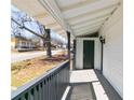 Inviting front porch with gray railing, providing a sheltered and pleasant space to relax or welcome guests at 1820 Spring St, Conyers, GA 30012