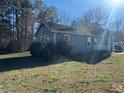 A grassy front lawn extends to the side of this single-story home at 57 Haven Ridge Dr, Carrollton, GA 30116