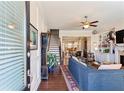 Inviting living room features hardwood floors, a ceiling fan, and an open floorplan at 327 Alderwood Ln, Atlanta, GA 30328