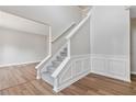 Classic staircase design with white trim and grey carpet at 4284 Hathaway Nw Ct, Kennesaw, GA 30144