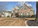 Beautiful brick home with well-manicured lawn and lovely landscaping at 448 Cape Ivey Dr, Dacula, GA 30019