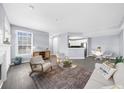 Bright living room with a large window and fireplace at 1115 Mcgill Park Ne Ave, Atlanta, GA 30312