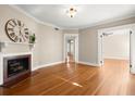 Spacious living room featuring hardwood floors and a cozy fireplace at 746 N Highland Ne Ave # 11, Atlanta, GA 30306