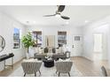 Bright living room with modern decor, sleek ceiling fan, and stylish furniture at 907 Oakhill Sw Ave, Atlanta, GA 30310