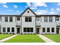 Beautiful townhome showcases painted brick, dark trim, and well-manicured lawns, creating great curb appeal at 1324 Parc Bench Rd, Atlanta, GA 30316