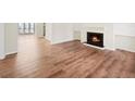 Cozy living room with hardwood floors and a fireplace, creating a warm ambiance at 601 Park Ridge Cir, Marietta, GA 30068