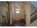 Bright foyer with wood floors, staircase, and a view of the front door at 3534 S Sherwood Se Rd, Smyrna, GA 30082