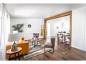 Open-concept living room showcasing hardwood floors and natural light at 157 Pebble Path, Douglasville, GA 30134
