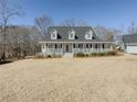 Lovely two-story home with full front porch and well-manicured lawn at 3179 Meadow Trl, Loganville, GA 30052