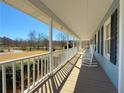 Inviting covered front porch with white rocking chairs, perfect for relaxing at 3179 Meadow Trl, Loganville, GA 30052