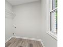 Clean laundry room with vinyl flooring and space for appliances at 1995 Venetian Sw Dr, Atlanta, GA 30311