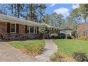 Traditional brick home featuring a walkway leading to the front entrance at 2436 Hazelwood Ne Dr, Atlanta, GA 30345