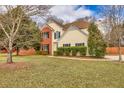 Classic two-story home with well-maintained lawn, hedges, and inviting curb appeal at 2800 Jona Trl, Dacula, GA 30019