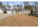 Charming single-story home with stone accents, covered entry, attached garage, and a well-maintained front yard at 4053 Overland Trl, Snellville, GA 30039