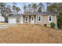 Charming single-story home with stone accents, covered entry, attached garage, and a well-maintained front yard at 4053 Overland Trl, Snellville, GA 30039