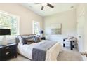 Comfortable bedroom with large bed and bedside tables at 3806 Jack Vernon Cir, Powder Springs, GA 30127