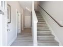 Bright entryway with light wood floors and staircase at 3806 Jack Vernon Cir, Powder Springs, GA 30127