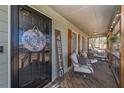 Covered front porch featuring comfortable seating and a welcoming ambiance at 9001 East Carroll Rd, Winston, GA 30187