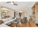 Open living room with wood floors, a ceiling fan, and a view of the dining area and kitchen at 1302 River Green Nw Dr # 1302, Atlanta, GA 30327