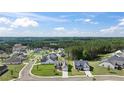 Stunning aerial view of a neighborhood with lush greenery and well-maintained homes at 477 Northside Dr, Canton, GA 30115
