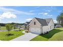 Beautiful home with a well-kept lawn, a two-car garage and a concrete driveway at 477 Northside Dr, Canton, GA 30115