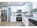 Modern kitchen with stainless appliances, stylish granite countertops, and new appliances at 2410 Macon Sw Dr, Atlanta, GA 30315