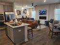 Open concept living space with an island, stainless appliances and comfortable seating at 5372 Tolar Rd, South Fulton, GA 30213