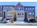 Charming brick townhomes feature attached garages and a traditional architectural style at 373 Via Secco Ln, Suwanee, GA 30024