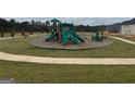 Modern playground area featuring slides, a climbing structure, and manicured landscaping at 5320 Tolar Rd, South Fulton, GA 30213