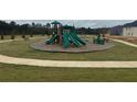 The community playground is surrounded by sidewalks and lush landscaping at 5320 Tolar Rd, South Fulton, GA 30213