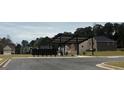 Street view of mailboxes and covered parking near a neighborhood park and playground at 5320 Tolar Rd, South Fulton, GA 30213
