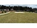 A beautiful volleyball court and other outdoor amenities are part of this vibrant community at 5320 Tolar Rd, South Fulton, GA 30213