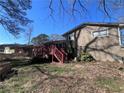 View of the backyard showcasing a wooden deck and home's exterior at 5430 Old Bill Cook Rd, Atlanta, GA 30349