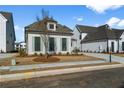 A beautifully landscaped front yard enhances this stylish home, complete with a neatly paved driveway at 574 Sawnee Village Blvd, Cumming, GA 30040