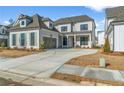 Beautiful home with a large driveway and two car garage at 574 Sawnee Village Blvd, Cumming, GA 30040