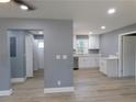 Open floorplan from the living room into the kitchen, with lots of open space at 1546 Alverado Way, Decatur, GA 30032