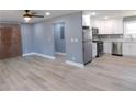Open-concept living room view that goes into the kitchen with stainless steel appliances at 1546 Alverado Way, Decatur, GA 30032