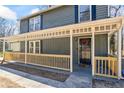 Welcoming front porch with a railing, offering a cozy outdoor space and curb appeal at 801 Hemingway Rd, Stone Mountain, GA 30088
