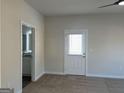 Bright bedroom featuring a ceiling fan and access to a private bathroom at 5305 Tolar Rd, South Fulton, GA 30213