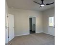 Spacious bedroom featuring a ceiling fan and access to a private bathroom at 5305 Tolar Rd, South Fulton, GA 30213
