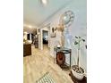 Inviting entryway featuring modern flooring, decorative accents, and an open transition to other living spaces at 1367 Midnight Ride Ct, Hampton, GA 30228