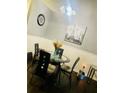 Eat-in dining area has glass table, modern chairs, and unique decorations at 6706 Sunset Valley Cir, Rex, GA 30273