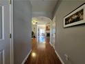 Hallway leading to living areas with hardwood floors at 3835 Pleasant Oaks Dr, Lawrenceville, GA 30044