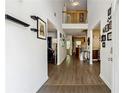Bright, open foyer featuring hardwood floors and a view of the staircase and upper level at 4240 N Braves Cir, Douglasville, GA 30135
