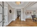 Bright foyer with hardwood floors, white trim, and decorative chair railing at 5810 Ripplestone Nw Ct, Acworth, GA 30101