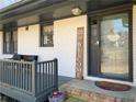 Inviting front porch with seating and a welcoming entrance with unique decor and a welcome sign at 170 Dillard Ne Dr, Kennesaw, GA 30144